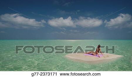 "Woman on a deserted island, Phuket, Thailand" View Large Photo Image Stock Image - "Woman on a deserted island, Phuket, Thailand". Fotosearch
