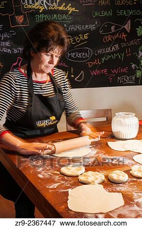 "Woman rolling dough for empanadas, Cooking class, Bellavista district, Santiago, Chile, South America. " View Large Photo Image Stock Photo - "Woman rolling dough for empanadas, Cooking class, Bellavista district, Santiago, Chile, South America. ". Fotosearch