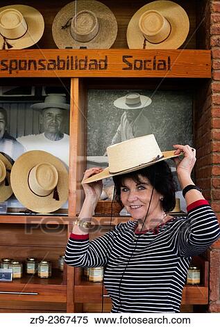 "Woman tries on a hat at Emiliana Organic Winery in Casablanca Valley, Chile, South America. " View Large Photo Image Stock Photography - "Woman tries on a hat at Emiliana Organic Winery in Casablanca Valley, Chile, South America. ". Fotosearch