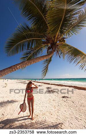 "Woman walking at the beach, Tulum, Quintana Roo, Yucatan Province, Mexico, Central America. " View Large Photo Image Stock Photo - "Woman walking at the beach, Tulum, Quintana Roo, Yucatan Province, Mexico, Central America. ". Fotosearch