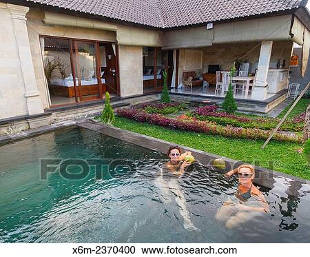 "Women in an hotel. Ubud. Bali. Indonesia, Asia. " View Large Photo Image Stock Image - "Women in an hotel. Ubud. Bali. Indonesia, Asia. ". Fotosearch