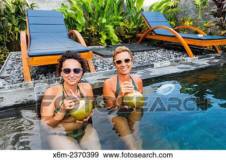 "Women in an hotel. Ubud. Bali. Indonesia, Asia. " View Large Photo Image Stock Photo - "Women in an hotel. Ubud. Bali. Indonesia, Asia. ". Fotosearch