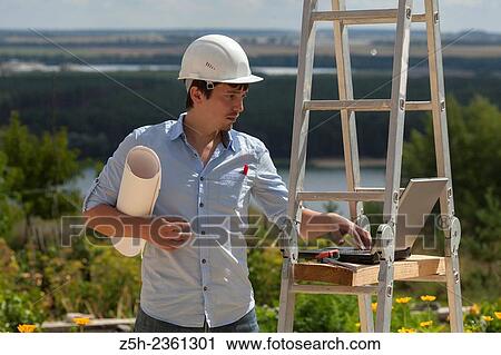 Stock Image - Young designer. Project work.. Fotosearch