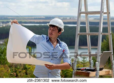 Stock Image - Young designer. Project work.. Fotosearch