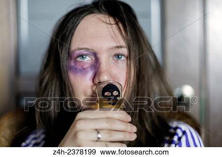 Stock Photo - Young girl drinking alcohol. Alcohol - injury. Love habits.. Fotosearch