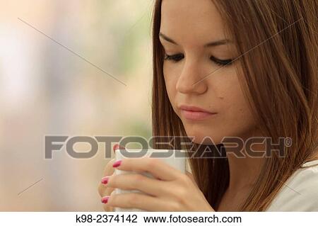 Stock Image - Young woman drinking cofee. Balearic Islands. Spain. Fotosearch