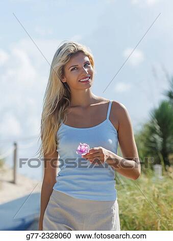 Stock Image - "Young woman on the beach. Miami Beach, Florida, USA". Fotosearch