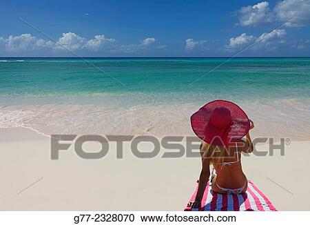 Stock Image - "Young woman on the beach. Miami Beach, Florida, USA". Fotosearch