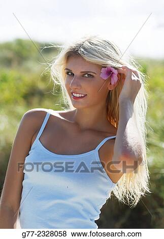 Stock Photo - "Young woman on the beach. Miami Beach, Florida, USA". Fotosearch
