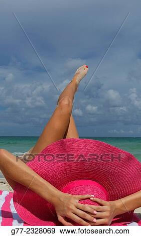 "Young woman on the beach. Miami Beach, Florida, USA" View Large Photo Image Stock Photo - "Young woman on the beach. Miami Beach, Florida, USA". Fotosearch
