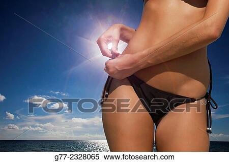 Stock Photography - "Young woman on the beach. Miami Beach, Florida, USA". Fotosearch