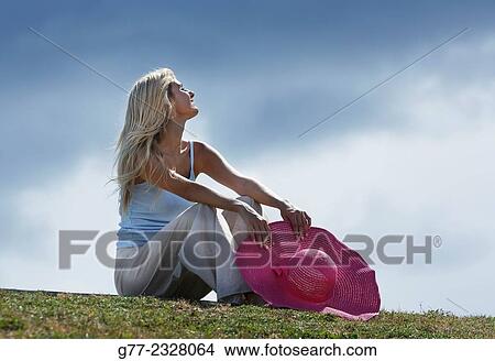 "Young woman relaxing in a park. Miami Beach, Florida, USA" View Large Photo Image Picture - "Young woman relaxing in a park. Miami Beach, Florida, USA". Fotosearch