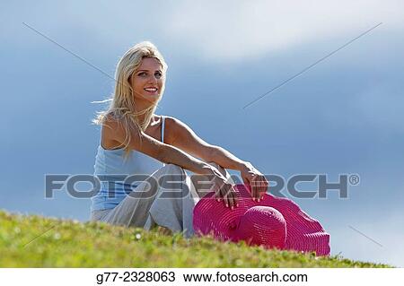 "Young woman relaxing in a park, Miami Beach, Florida, USA" View Large Photo Image Stock Image - "Young woman relaxing in a park, Miami Beach, Florida, USA". Fotosearch