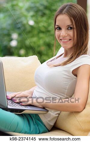 Young woman using laptop. Balearic Islands. Spain View Large Photo Image Stock Photography - Young woman using laptop. Balearic Islands. Spain. Fotosearch