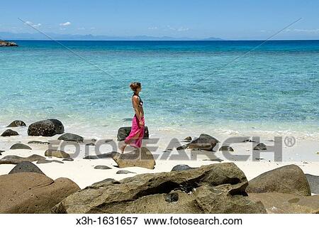 "young woman walking on the beach, Tsarabanjina island, Mitsio archipelago, Republic of Madagascar, Indian Ocean" View Large Photo Image Stock Photo - "young woman walking on the beach, Tsarabanjina island, Mitsio archipelago, Republic of Madagascar, Indian Ocean". Fotosearch