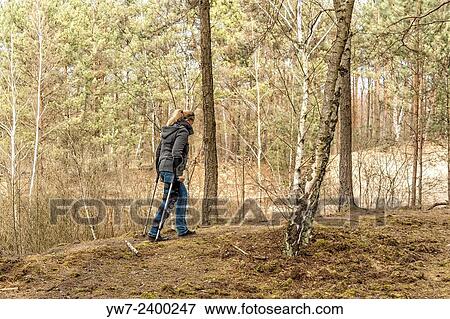 "Adult woman in orthosis having a walk in Kampinos National Park, Poland. " View Large Photo Image Stock Photo - "Adult woman in orthosis having a walk in Kampinos National Park, Poland. ". Fotosearch