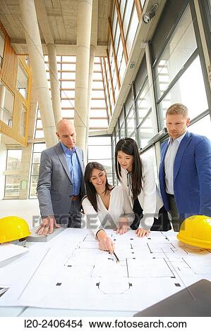 Architects looking at blueprints View Large Photo Image Picture - Architects looking at blueprints. Fotosearch