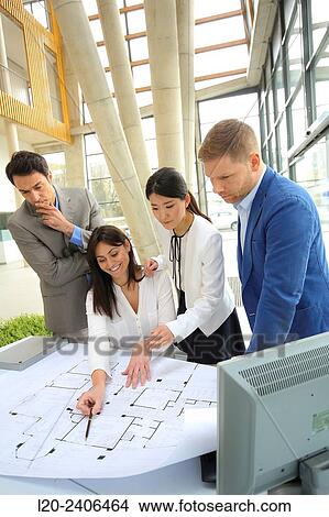 Architects looking at blueprints View Large Photo Image Picture - Architects looking at blueprints. Fotosearch