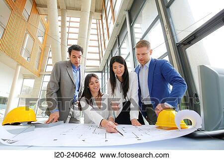 Architects looking at blueprints View Large Photo Image Stock Image - Architects looking at blueprints. Fotosearch