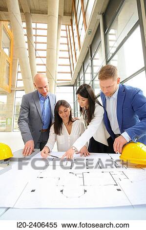 Architects looking at blueprints View Large Photo Image Stock Photography - Architects looking at blueprints. Fotosearch
