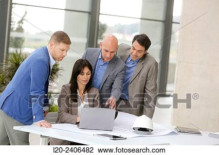Stock Image - Architects meeting. Fotosearch