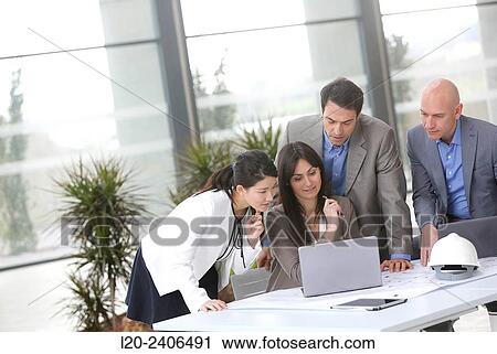 Stock Image - Architects meeting. Fotosearch