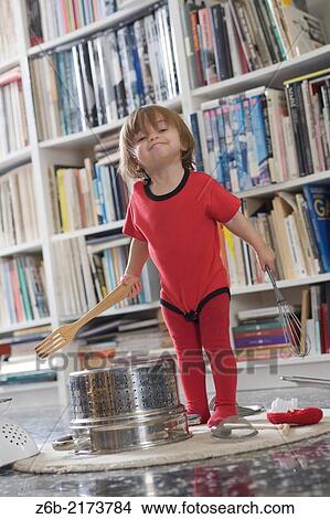 "Baby, 15 Months, Noise, Kitchen Tool, Colander, Wooden fork, Whisk, Ramones body-Suit, carpet, books" View Large Photo Image Picture - "Baby, 15 Months, Noise, Kitchen Tool, Colander, Wooden fork, Whisk, Ramones body-Suit, carpet, books". Fotosearch