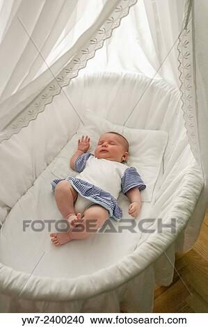 Baby girl sleeping in a cradle. View Large Photo Image Stock Image - Baby girl sleeping in a cradle.. Fotosearch