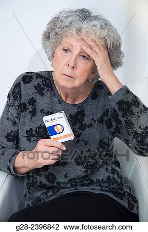 "Beautiful senior woman, lost in her thoughts, suffering from depression, holding a box of Prozac tablets" View Large Photo Image Stock Image - "Beautiful senior woman, lost in her thoughts, suffering from depression, holding a box of Prozac tablets". Fotosearch