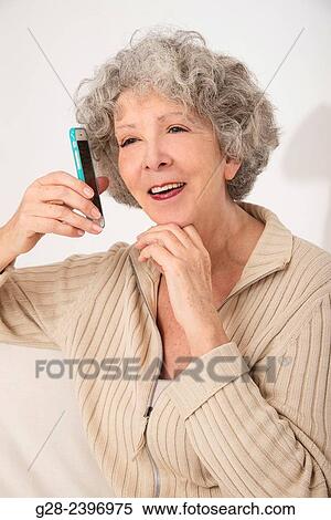 Beautiful surprised senior woman on the phone laughing View Large Photo Image Stock Photography - Beautiful surprised senior woman on the phone laughing. Fotosearch