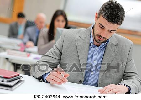 Businessman taking notes View Large Photo Image Picture - Businessman taking notes. Fotosearch