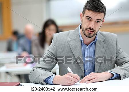 Businessman taking notes View Large Photo Image Stock Image - Businessman taking notes. Fotosearch