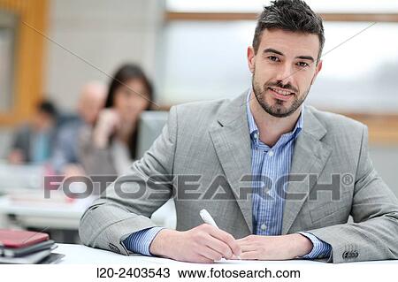 Businessman taking notes View Large Photo Image Stock Image - Businessman taking notes. Fotosearch