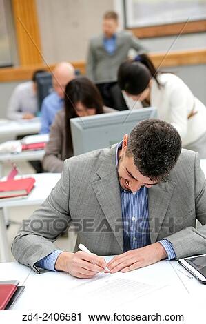 Businessman taking notes View Large Photo Image Stock Image - Businessman taking notes. Fotosearch