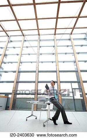 Businessman with digital tablet View Large Photo Image Stock Image - Businessman with digital tablet. Fotosearch