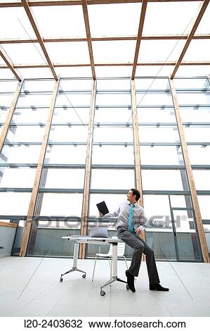 Businessman with digital tablet View Large Photo Image Stock Image - Businessman with digital tablet. Fotosearch