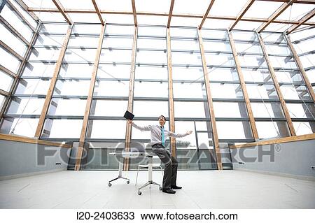 Stock Image - Businessman with digital tablet. Fotosearch
