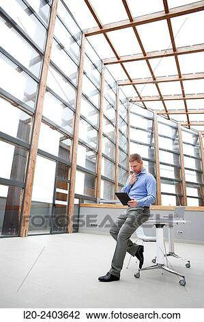 Businessman with digital tablet View Large Photo Image Stock Image - Businessman with digital tablet. Fotosearch