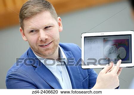 Businessman with tablet View Large Photo Image Stock Image - Businessman with tablet. Fotosearch