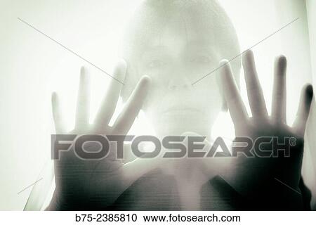 "Closeup of a hands on position of attention and pressure with the silhouette of a woman in the background, behind a transparent curtain. " View Large Photo Image Stock Image - "Closeup of a hands on position of attention and pressure with the silhouette of a woman in the background, behind a transparent curtain. ". Fotosearch