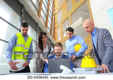 Engineers looking at map View Large Photo Image Stock Image - Engineers looking at map. Fotosearch