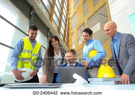 Engineers looking at map View Large Photo Image Stock Image - Engineers looking at map. Fotosearch