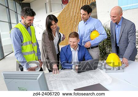 Engineers looking at map View Large Photo Image Stock Image - Engineers looking at map. Fotosearch