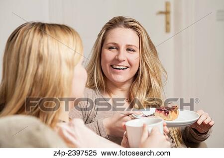 "girlfriends in coffee gossip, one looks happy. " View Large Photo Image Stock Photography - "girlfriends in coffee gossip, one looks happy. ". Fotosearch