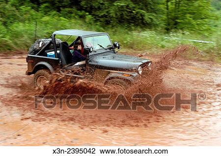 Jeep driving through a stream. View Large Photo Image Stock Image - Jeep driving through a stream.. Fotosearch