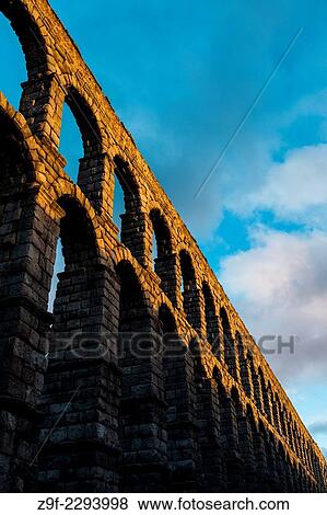 Stock Photo - "Light of sunset in the Aqueduct of Segovia, Spain". Fotosearch
