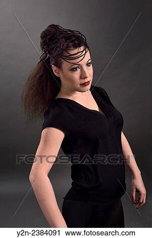 Model in black impersonating mannequin with hair style. View Large Photo Image Stock Image - Model in black impersonating mannequin with hair style.. Fotosearch