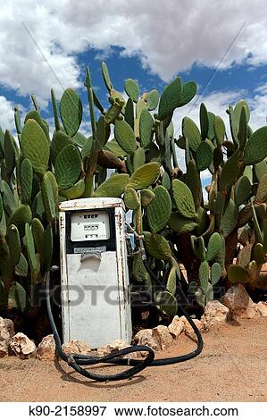 "Old gasoline pump in the desert with green cacti behind, Solitaire, Namibia, Africa. " View Large Photo Image Stock Photo - "Old gasoline pump in the desert with green cacti behind, Solitaire, Namibia, Africa. ". Fotosearch