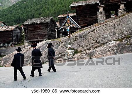 "Orthodox Jews walking in Saas Fee, Switzerland" View Large Photo Image Stock Photograph - "Orthodox Jews walking in Saas Fee, Switzerland". Fotosearch
