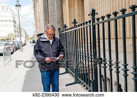 Senior male tourist in Paris View Large Photo Image Stock Image - Senior male tourist in Paris. Fotosearch